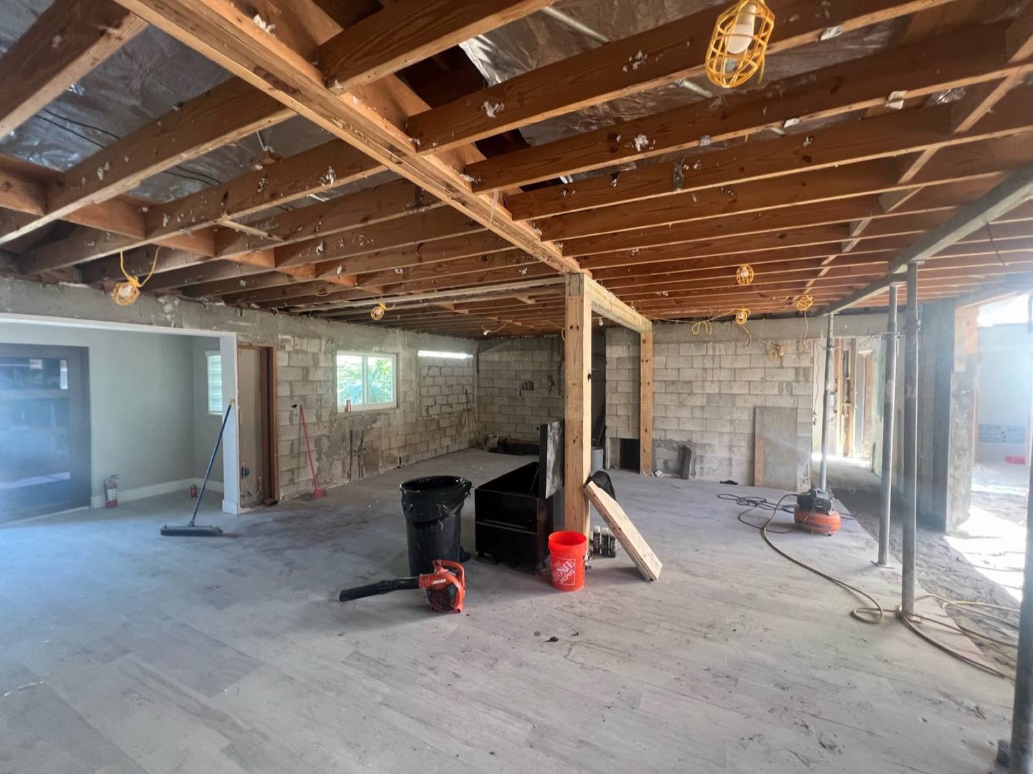The Pinecrest living room during construction, framed open to the garden