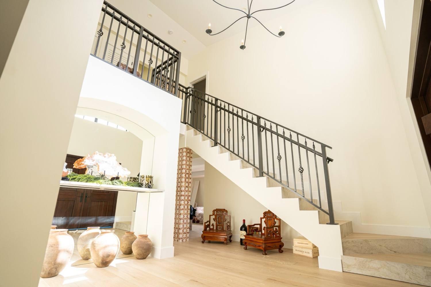 The finished stair of the Coral Gables historic district house with iron railings