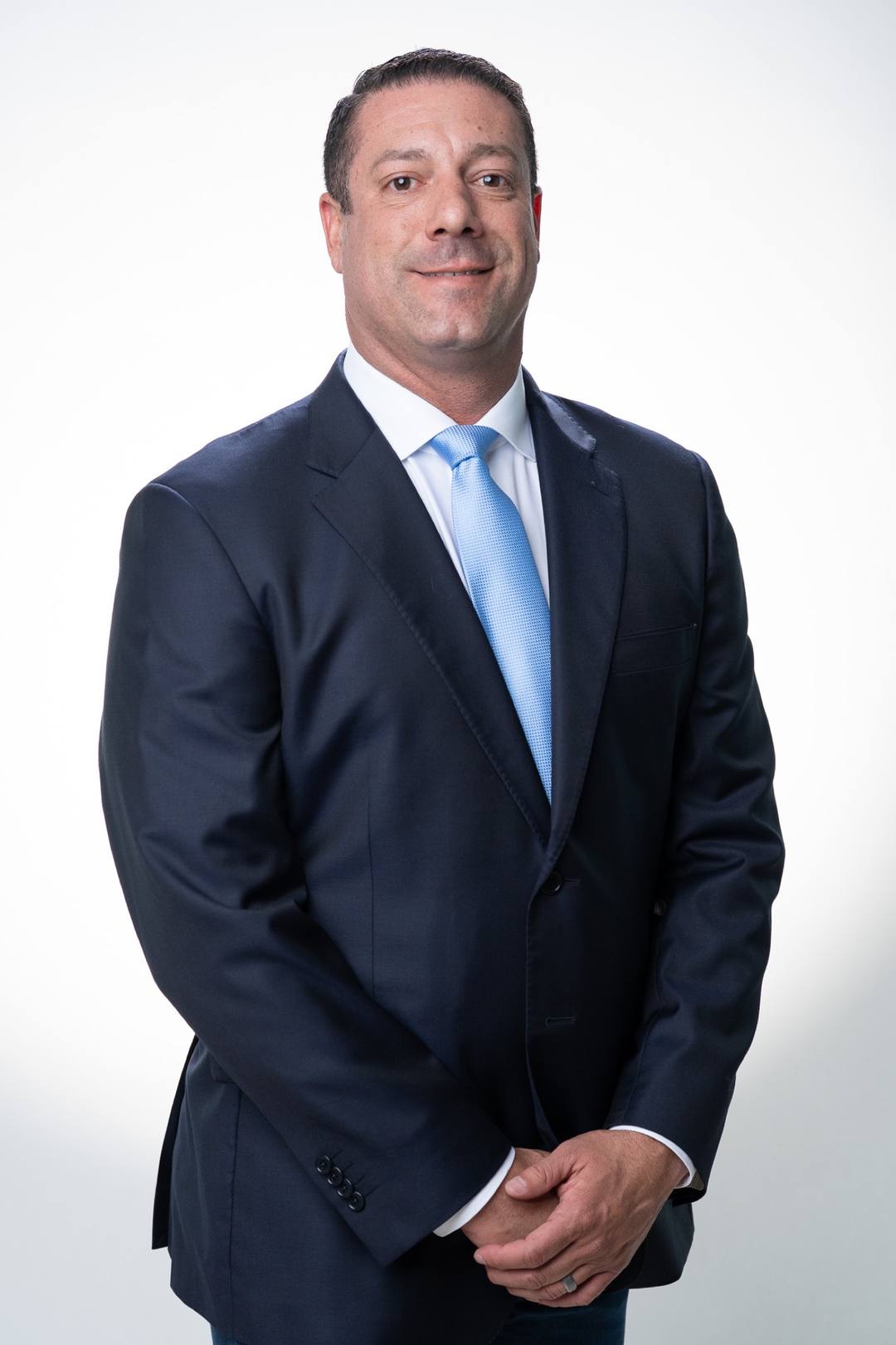 Dan Girado, founder of DAG Development and Construction, in a navy suit
