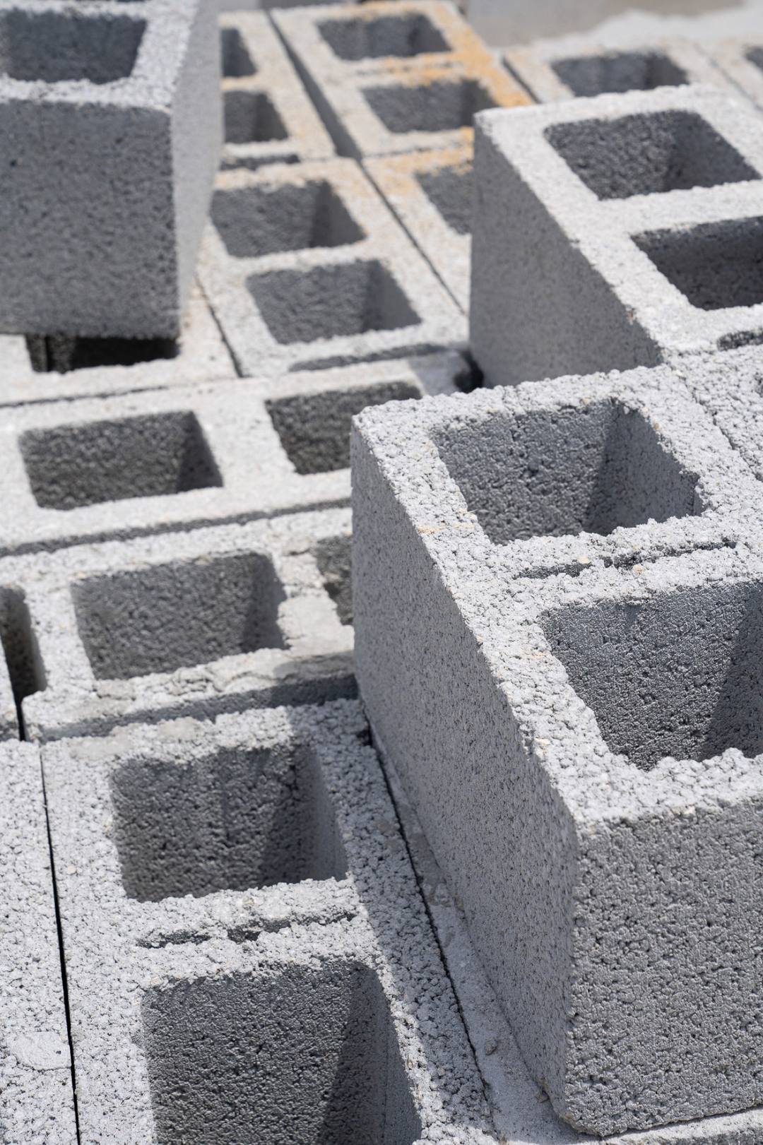 Concrete block units stacked on site for the walls, close up