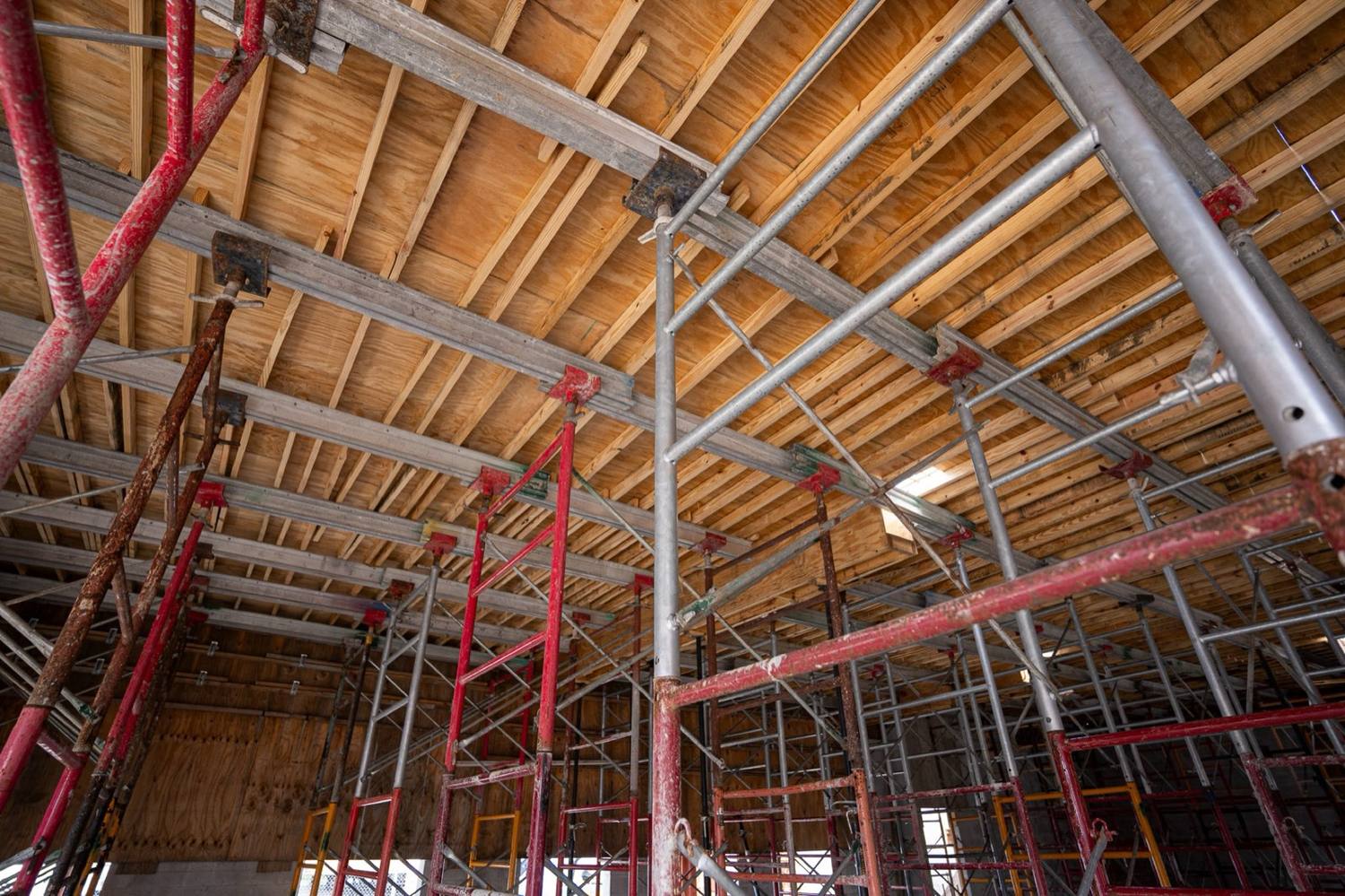 Inside the Opa-locka office building during construction, scaffolding under the ceiling