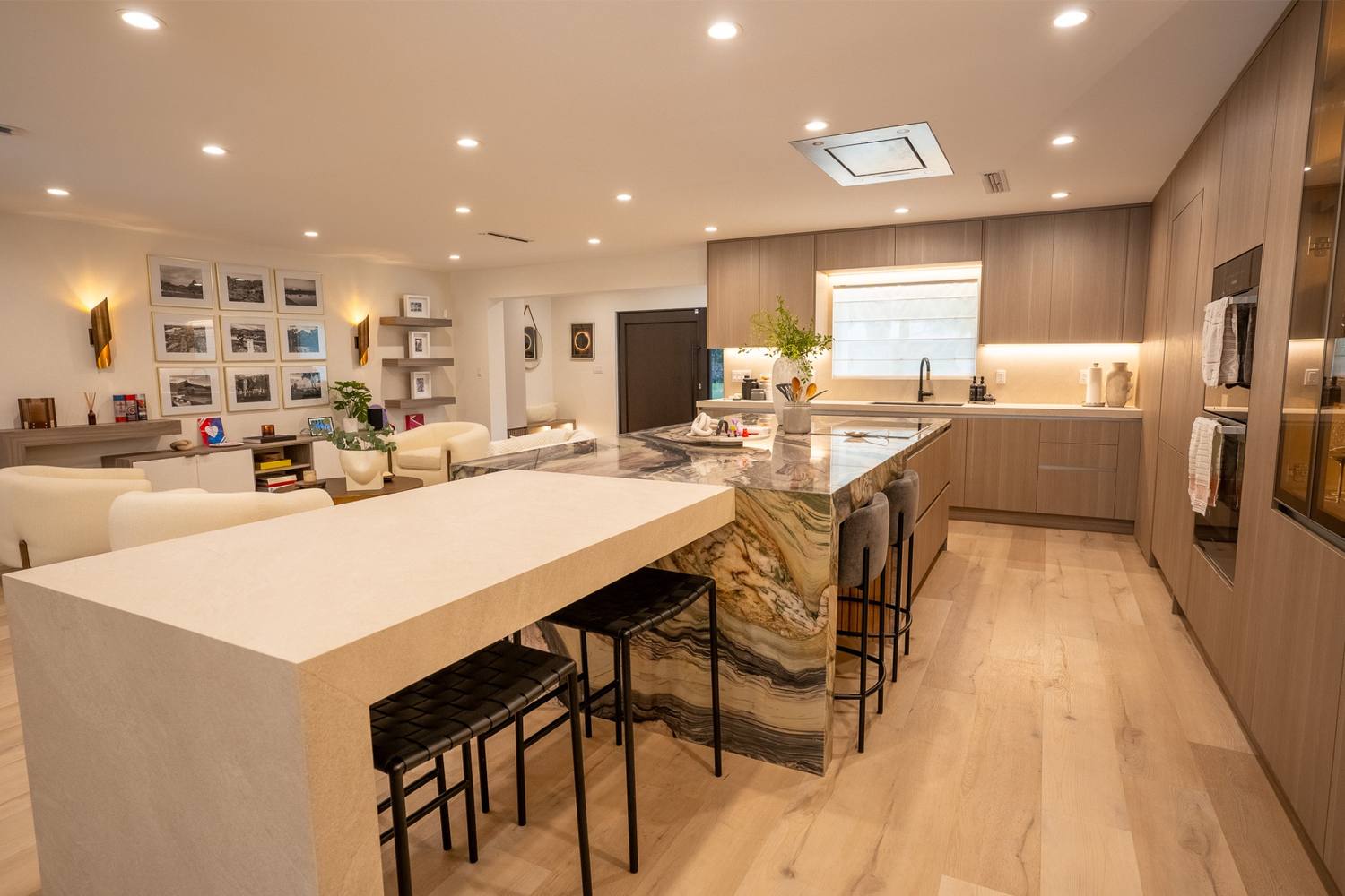 Kitchen and bar wall seen wide from the island