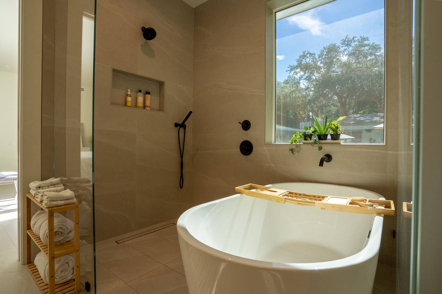Primary bathroom, a second view of the freestanding tub under the window